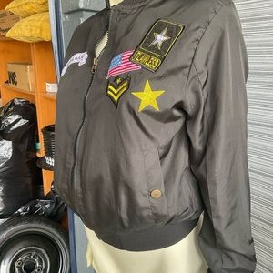A cute black bomber jacket with army patchwork.